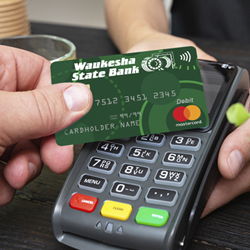 person shopping with a Waukesha State Bank debit card