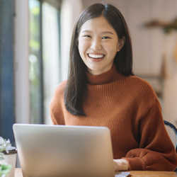 college student with laptop at job