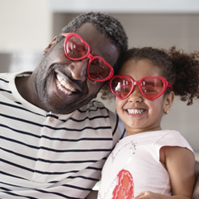 dad and daughter wearing heart glasses