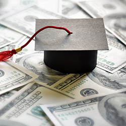 graduation cap with money