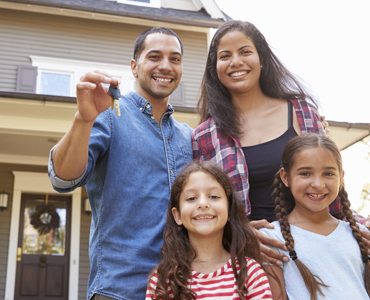 family with keys to house