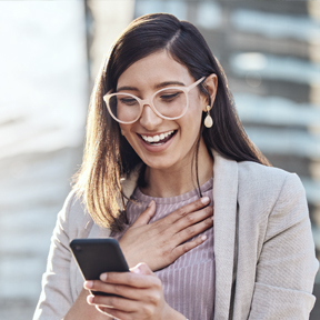 happy woman looking at smartphone