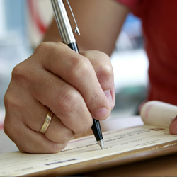 girl writing check