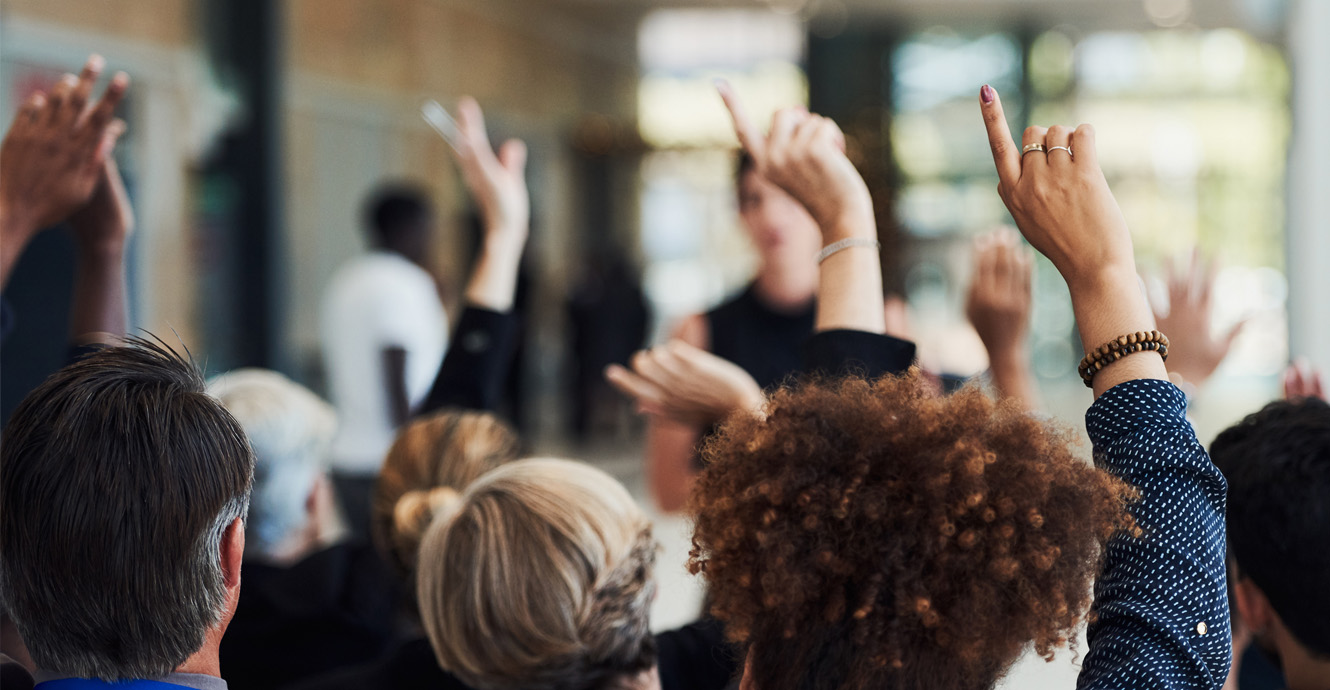 meeting with raised hands