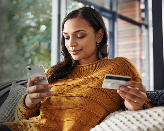 woman using her Mastercard on her phone