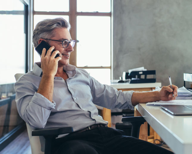 Businessman talking on a cell phone.