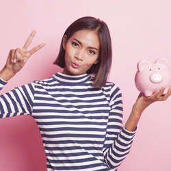 teen girl with piggy bank