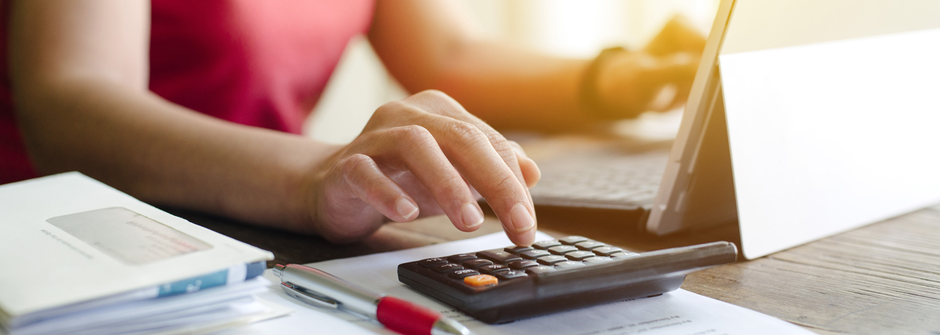 Woman using calculator