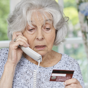 elderly woman with credit card