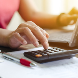woman using calculator