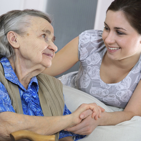 woman helping elderly woman