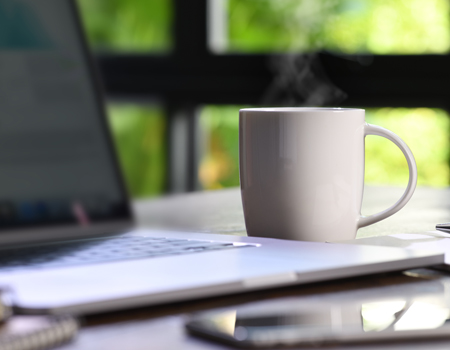 laptop with coffee cup