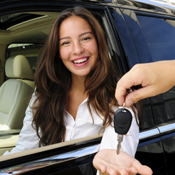 teen girl getting keys to new car