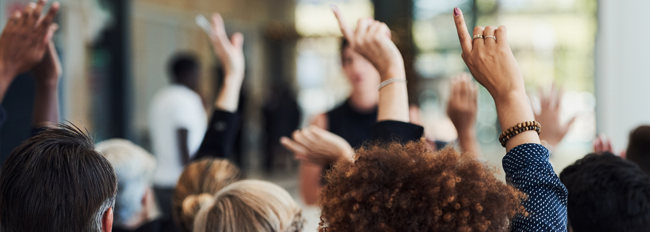 meeting with raised hands