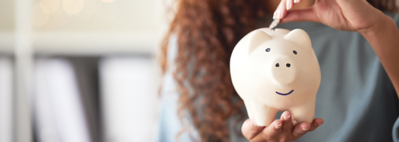 Woman with piggy bank