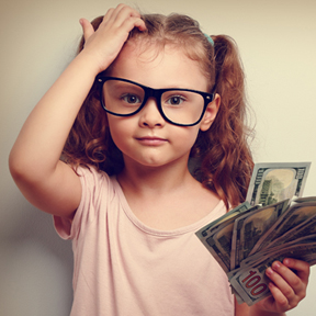 little girl holding cash