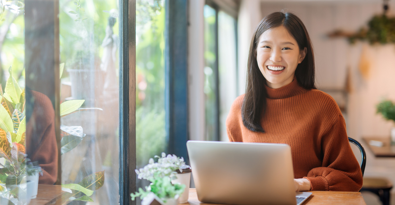 smiling business woman on laptop