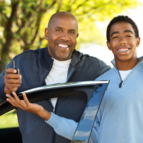 dad with car keys and son