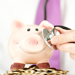 piggy bank with stethoscope